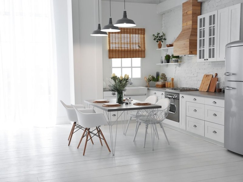 white kitchen and white laminate floor from A.T. Frank Floors in Michigan area