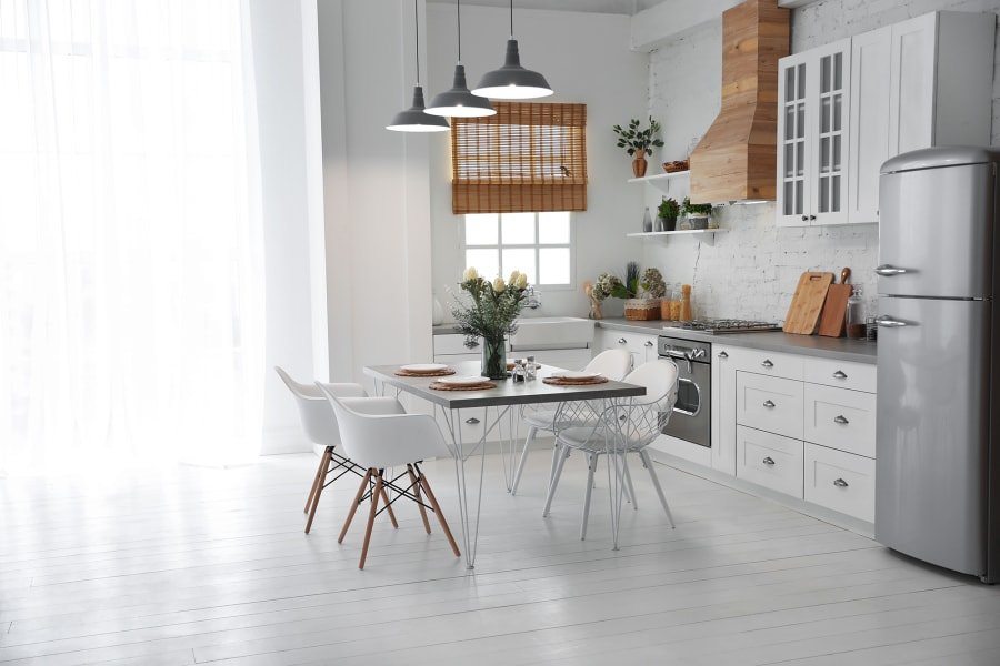 white kitchen and white laminate floor from A.T. Frank Floors in Michigan area