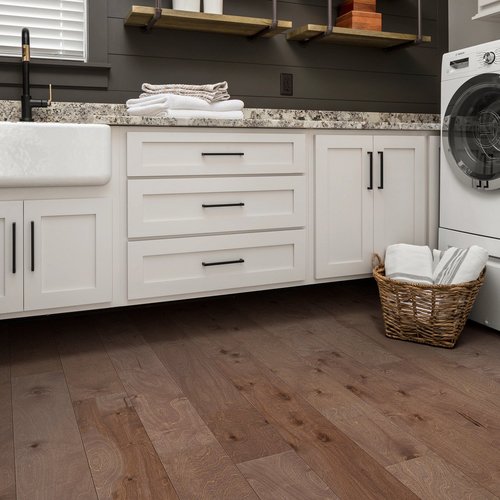 Basket laundry on a brown hardwood from A.T. Frank Floors Across Michigan