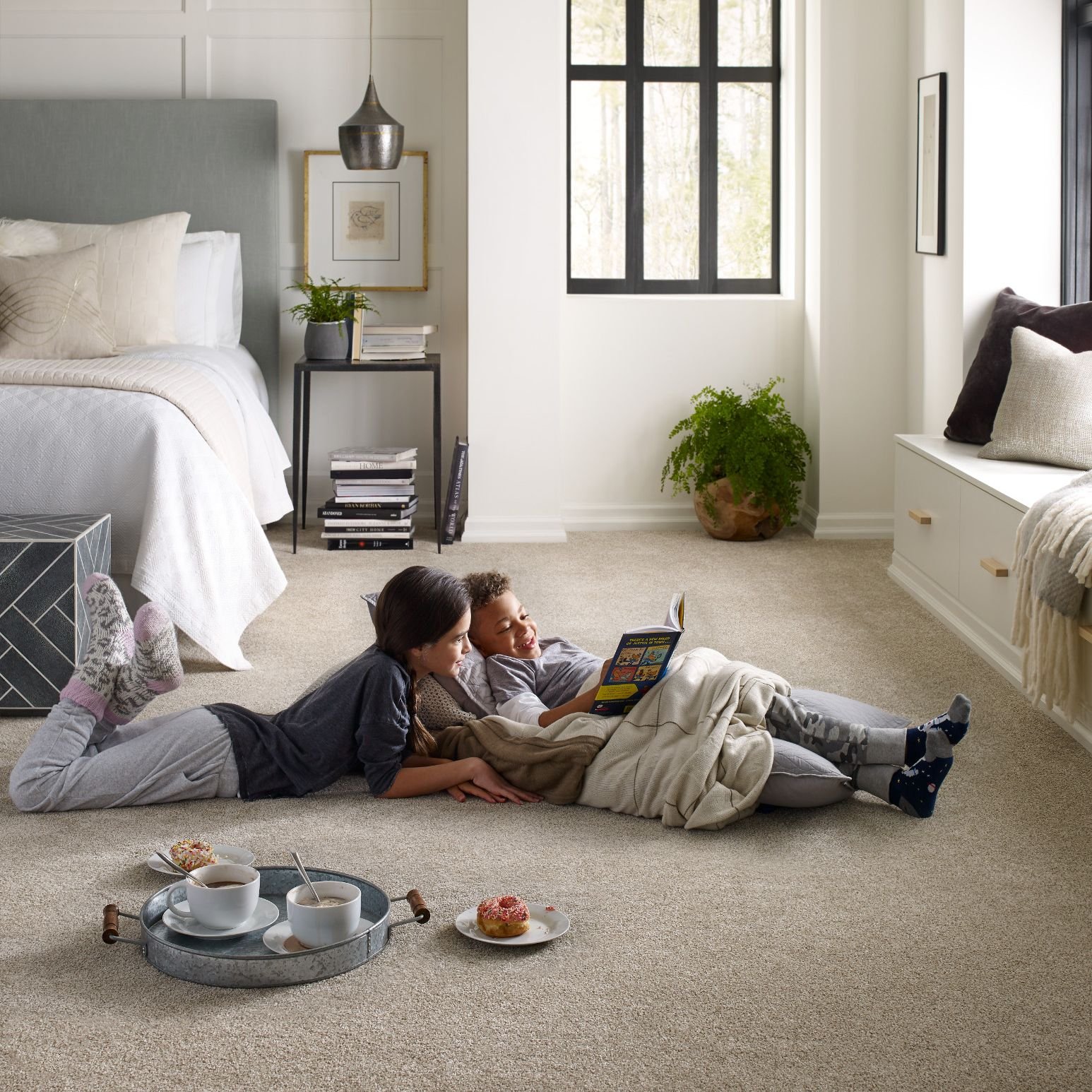 Kids reading on a carpet floor from A.T. Frank Floors Across Michigan